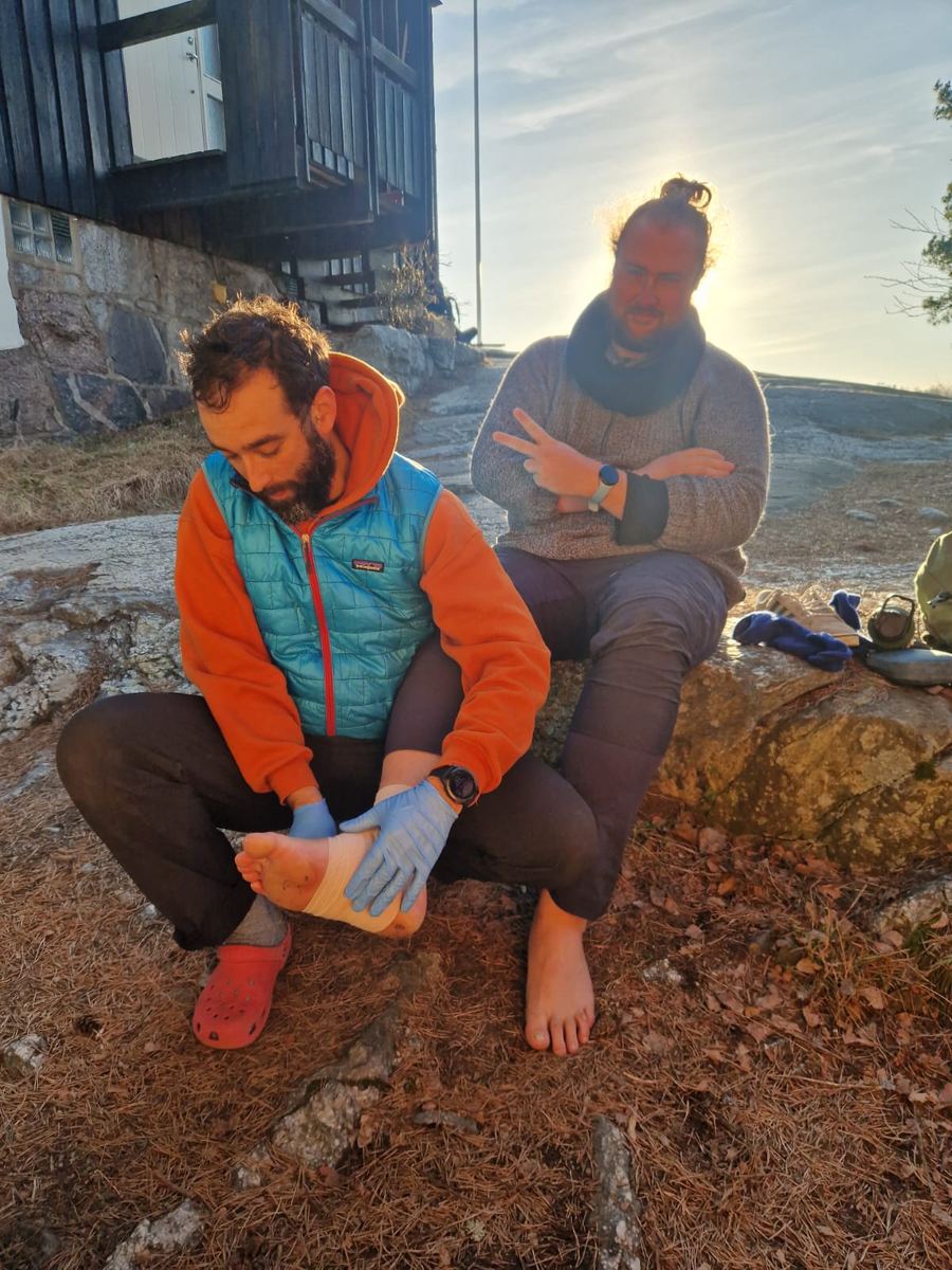 Leon's sprained ankle being assessed outdoors