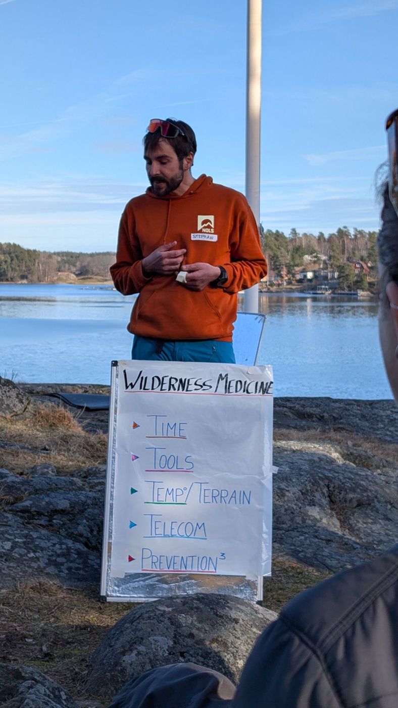 NOLS instructor teaching Wilderness Medicine outdoors in Sweden